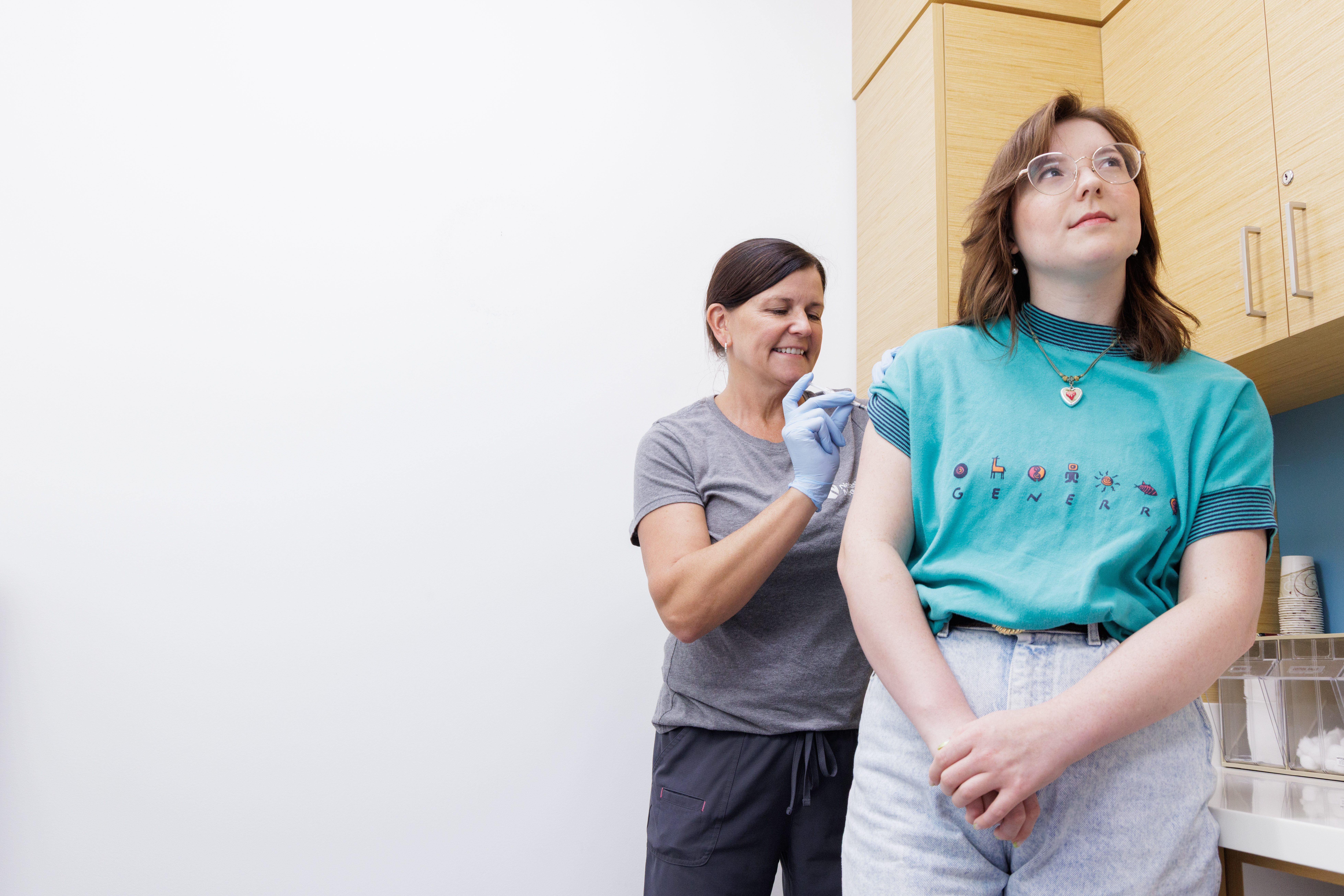 Allergy nurse administering serum to patient's arm