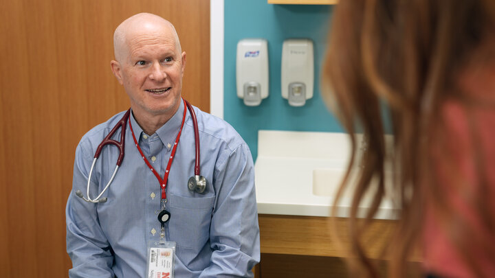 Doctor talking with stethoscope