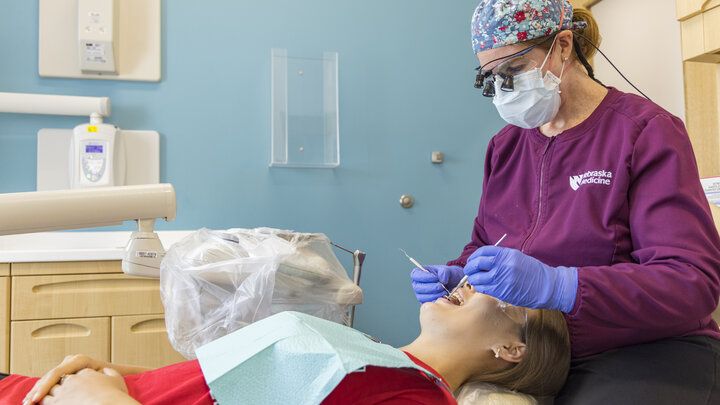 Dentist working on patient's teeth