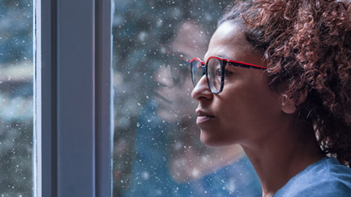 Woman looking out a window