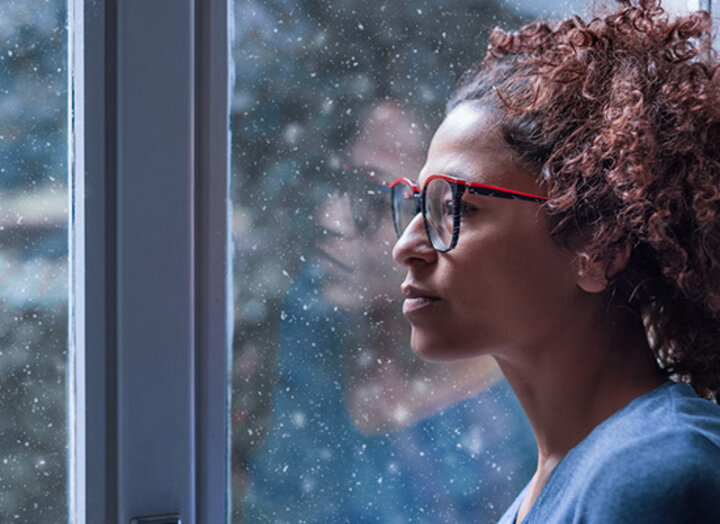 Woman looking out a window
