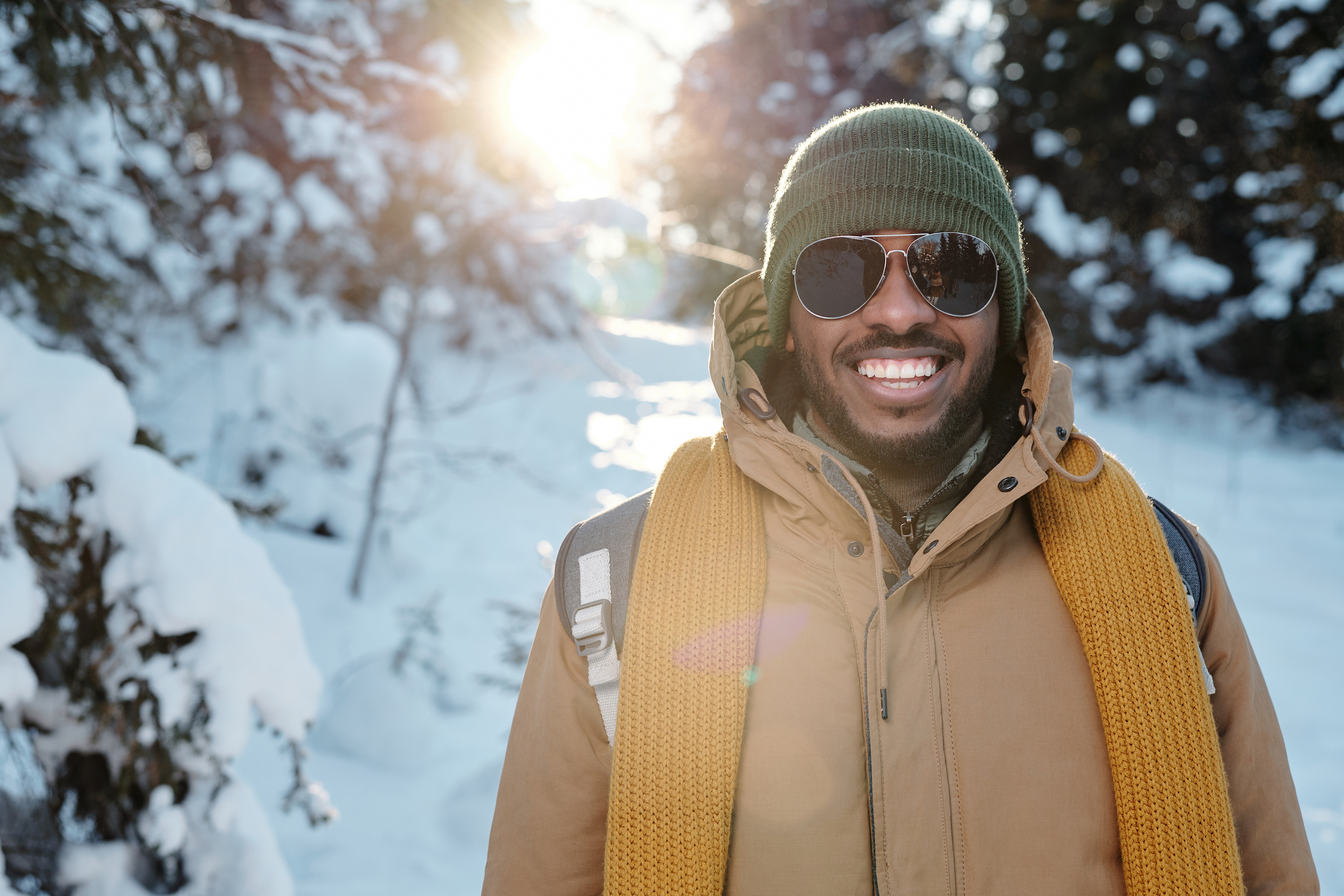 Student stands in the snow wearing winter attire