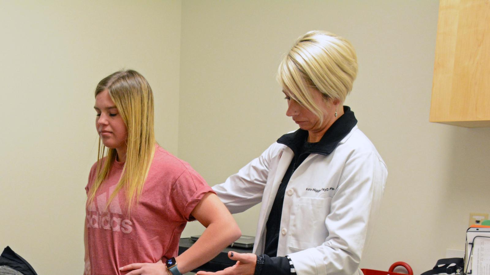 Dr. Higgins guides concussion clinic patient