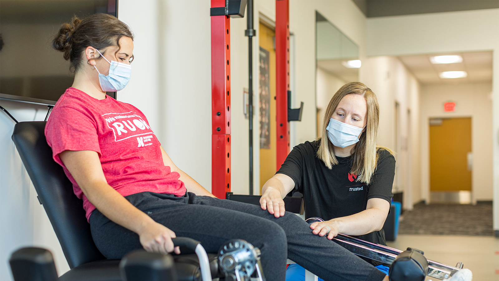 Physical therapist Kelsey Richters assists patient